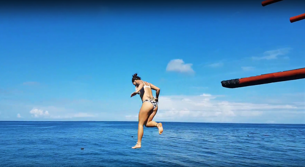 cliffjumping girl ocean